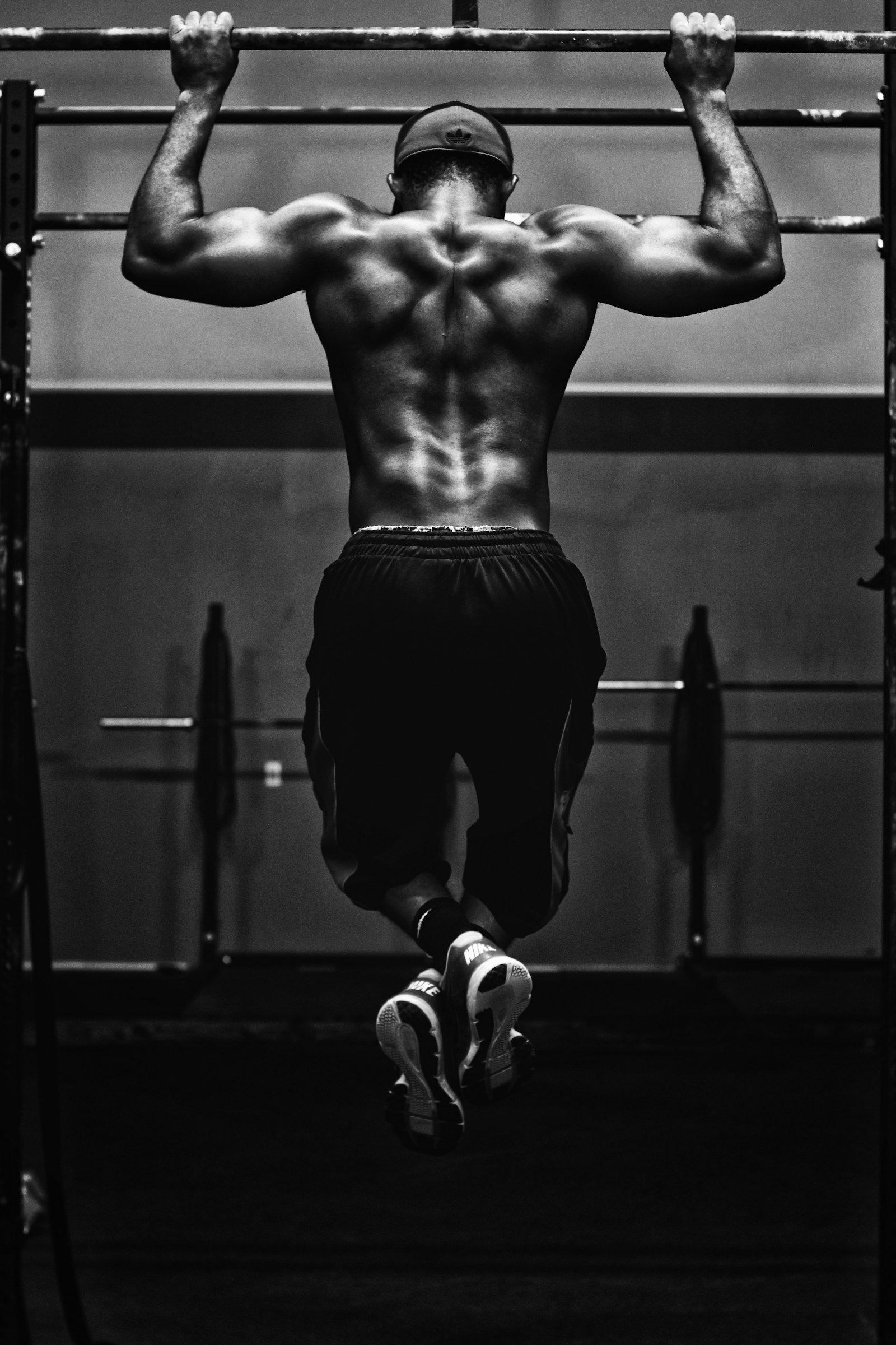 Chalked hands gripping a barbell before a heavy deadlift